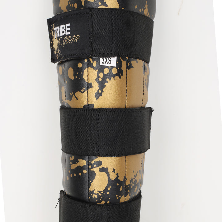 TRIBE GEAR Scheenbeschermers Kids – Gold Splash Edition
